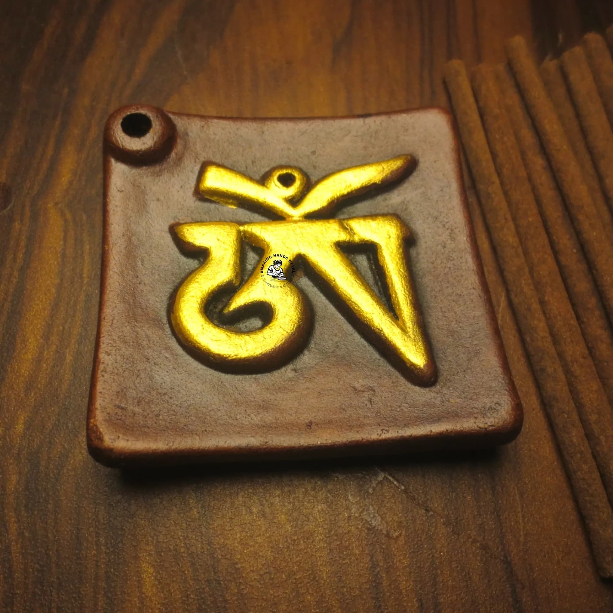 Golden Tibetan Om Clay Incense Holder